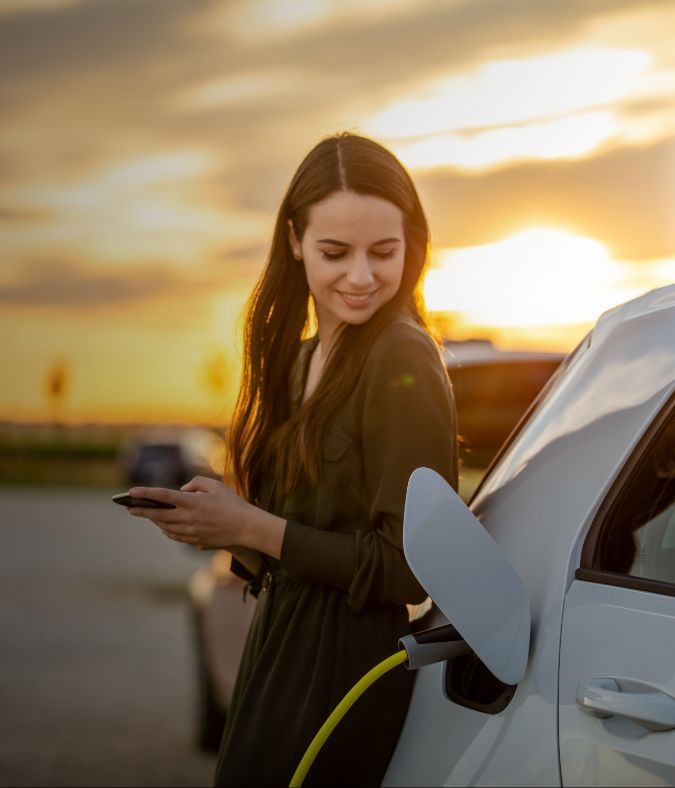 Girl charing electric car